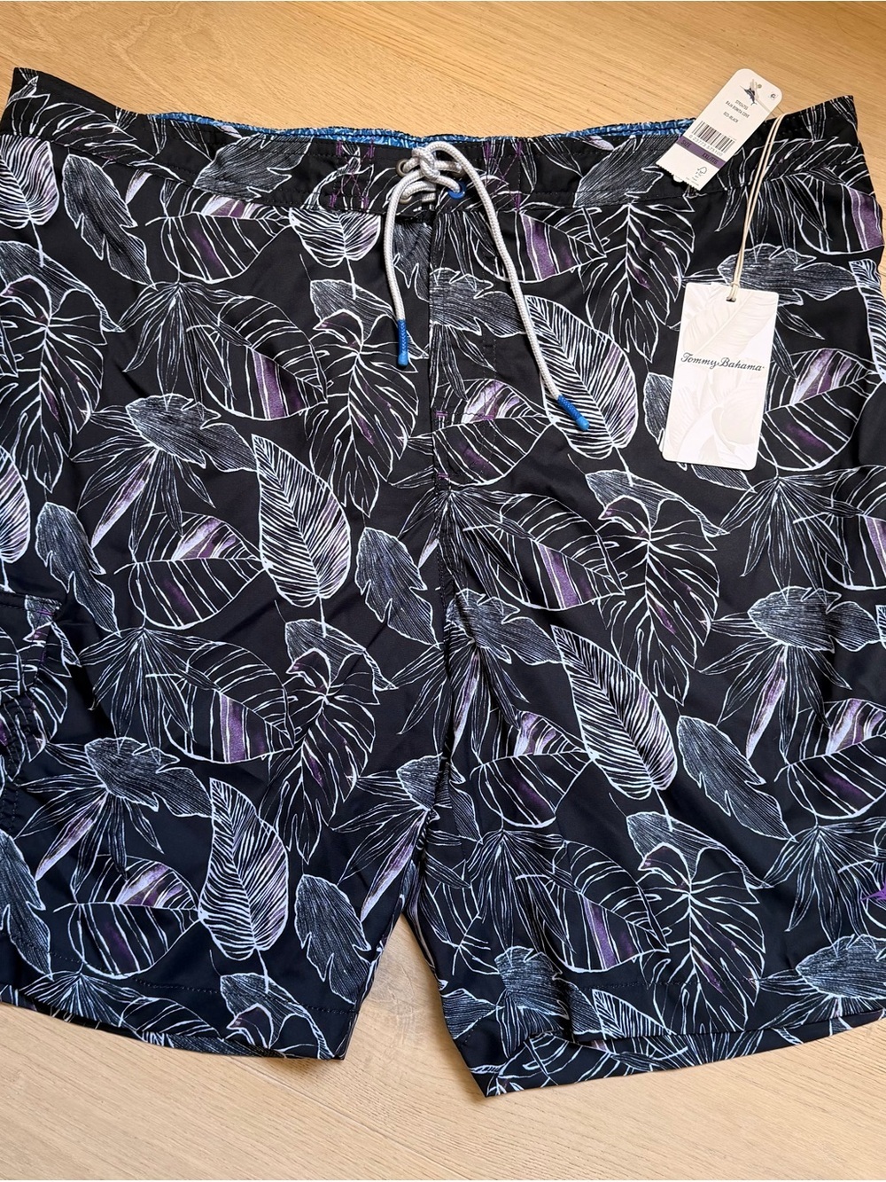 Tommy Bahama Black Swim Trunks with White Leaf Sketches and Purple Highlights